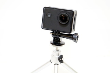 Action camera with tripod