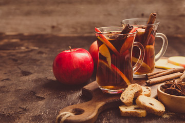 hot spicy beverage. Hot drink (apple tea, punch) with cinnamon stick and star anise. Seasonal mulled drink