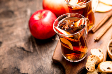 hot spicy beverage. Hot drink (apple tea, punch) with cinnamon stick and star anise. Seasonal mulled drink
