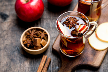 hot spicy beverage. Hot drink (apple tea, punch) with cinnamon stick and star anise. Seasonal mulled drink