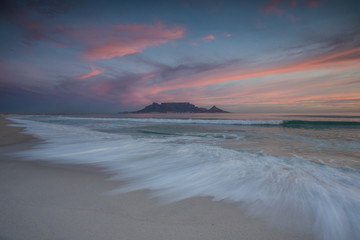 Beautiful wide angle landscape image of Table Mountain in Cape Town South Africa as seen from Blouberg beach