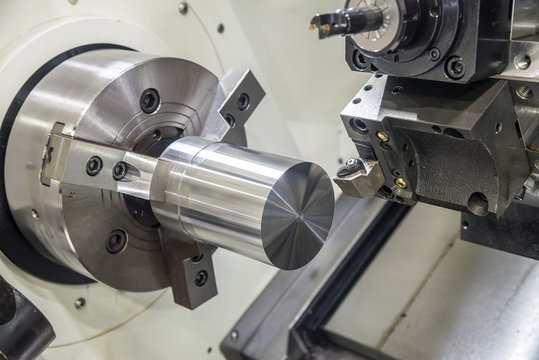 The CNC lathe  machine clamping  steel rod . High precision CNC machining concept