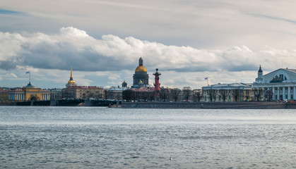 Fototapeta na wymiar Panorama of the arrow of the Vasilievsky Island on a cloudy April day in St. Petersburg
