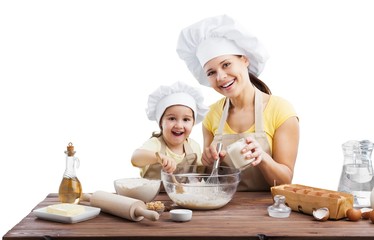 Portrait of adorable little girl and her mother baking together