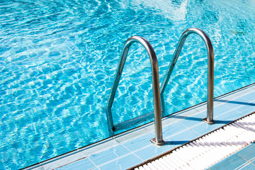 Clear transparent pool water and railings