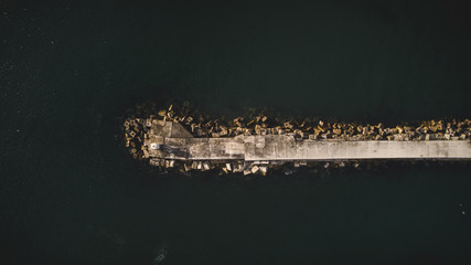Aerial views over Gansbaai harbor in the overberg in the Western Cape of South Africa With fishing vessels laying at anchor in the harbor