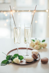 Fototapeta na wymiar Luxurious champagne wedding party with white roses and macaron d