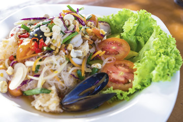 Yummy mixed seafood on a white plate.