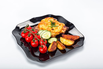 Grilled steak, French fries and vegetables