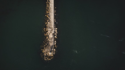 Aerial views over Gansbaai harbor in the overberg in the Western Cape of South Africa With fishing vessels laying at anchor in the harbor