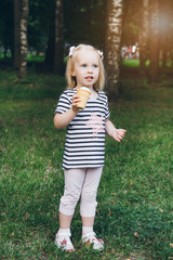 Little girl eating delicious ice cream