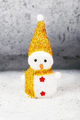 Snowman wearing hat and scarf