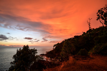 dramatic sunset over the ocean at cliffs