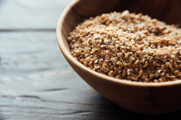 Bowl with bulgur. Uncooked