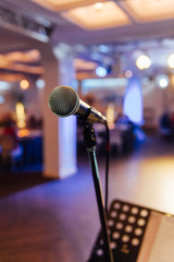 Microphone on blurred of speech in seminar room