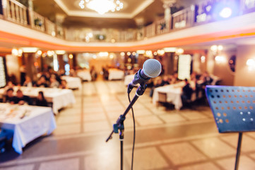 Microphone on blurred of speech in seminar room