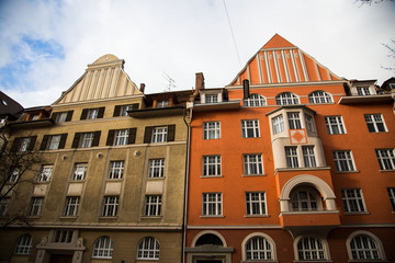 Old houses in Schwabing, orange and green facade