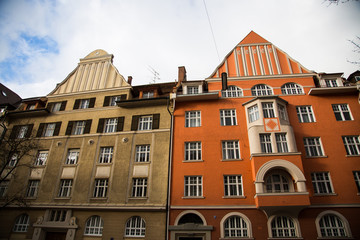Old houses in Schwabing, orange and green facade