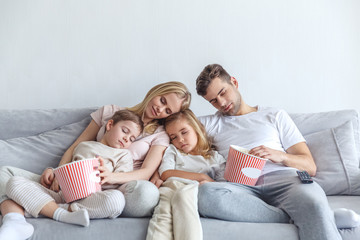 family fell a sleep while watch movie at home