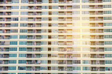 Fototapeta na wymiar Apartment building windows pattern.Detail of the facade of apartment building