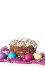 Scattered painted easter chicken eggs, traditional orthodox christian easter food kulich with raisins and branches of willow