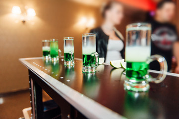 preparing green mexican cocktail drink at the bar
