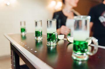 preparing green mexican cocktail drink at the bar