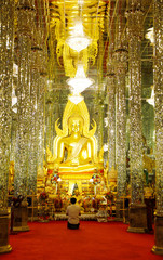The Thai Buddhist is worship the statue of Buddha the spirit house during new year in thailand