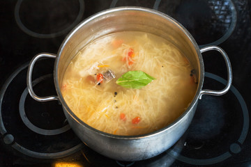 soup from stewed sour cabbage in stockpot