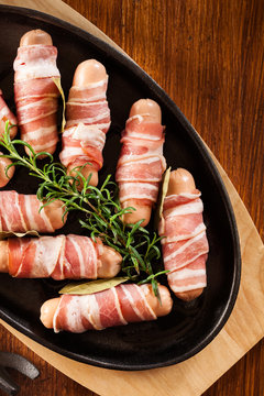 Raw Mini Sausages Wrapped In Smoked Bacon
