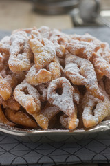 Angel wings biscuits, a traditional European sweet dish for carnival. Rustic style.