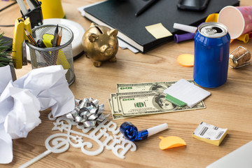 close up view of party decorations and dollars at workplace in office