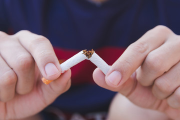 Stop cigarette, man hands breaking the cigarette with clipping path