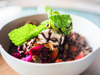 fresh granola breakfast bowl with strawberry