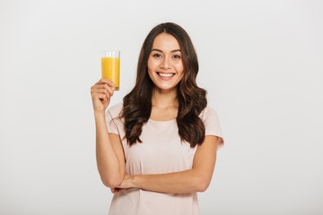 Portrait of a happy young asian woman holding glass