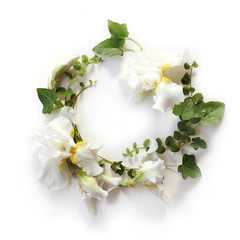 Fresh holiday floral frame made of Iris white flowers, buds and green ivy branches on white...