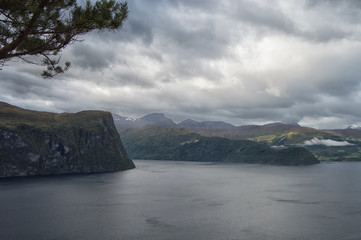 Beautiful Norwegian fjord with mountains in the background before the rain. Landscape