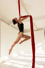 Girl training on aerial silks