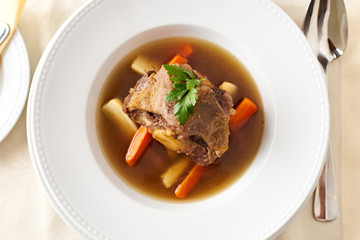 Beef broth with beef tail bone in a restaurant