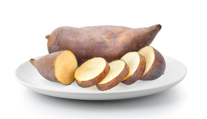 Fresh Yacon roots in plate isolated on a white background