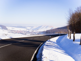 The road in winter with sunshine without clouds