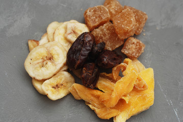 Mix of Dry fruits on Gray Background Isolated. Top View. Healthy snack Food.