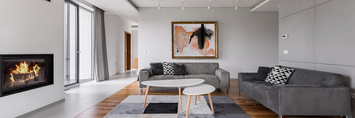 Villa living room with fireplace - obrazy, fototapety, plakaty