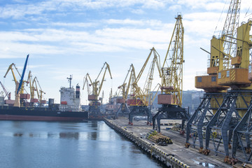 Fototapeta na wymiar Cranes in seaport.