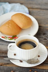 Delicious Americano coffee and pies on the table 