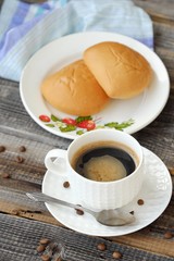 Delicious Americano coffee and pies on the table 