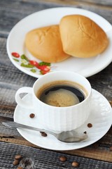 Delicious Americano coffee and pies on the table 