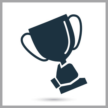 Winner cup at hand simple icon