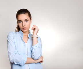 beautiful young woman with long hair wearing wrist watch