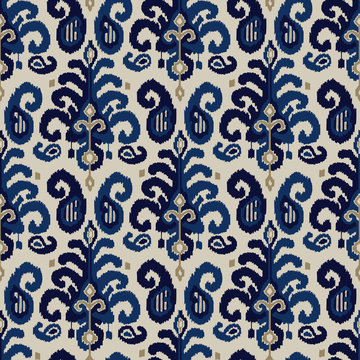 Seamless ikat paisley pattern. Traditional oriental ethnic ornament. Indigo, cobalt blue and beige on ecru background. Textile design.